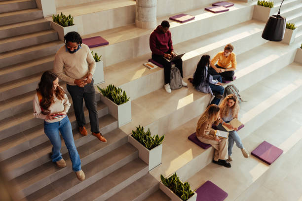 istock University students walking and studying in modern bleachers 2190479024