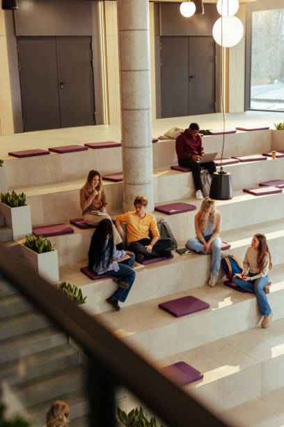 istock University students relaxing and studying in modern open space area 2190479851