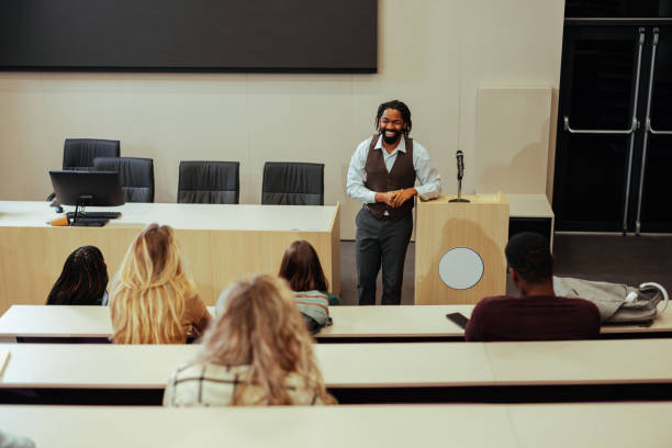 Dynamic Lecturring 900+ Professor Teaching From Podium Stock Photos, Pictures & Royalty ...