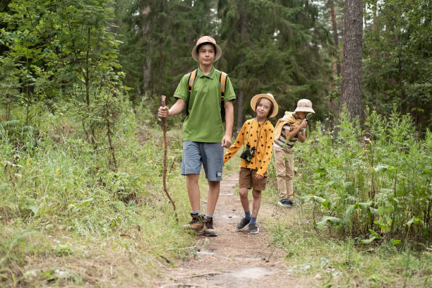 istock Children on a hike in the forest. 2190480558