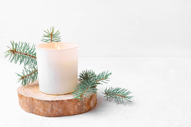 istock Scented candle in white glass and pine twigs 2190480823