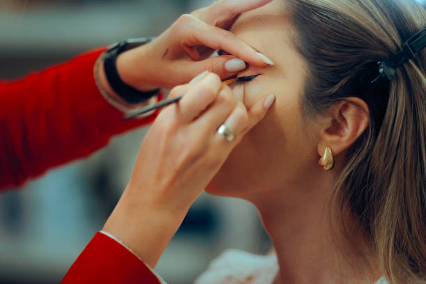 istock Professional Makeup Artist Making Perfect Eye wing with Liner 2190481788
