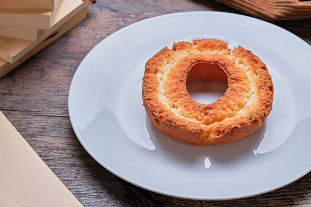 istock Old fashioned donuts and coffee on a wooden table. 2190484590