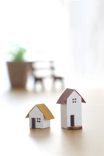 istock Miniature model of a house by the window 2190484911