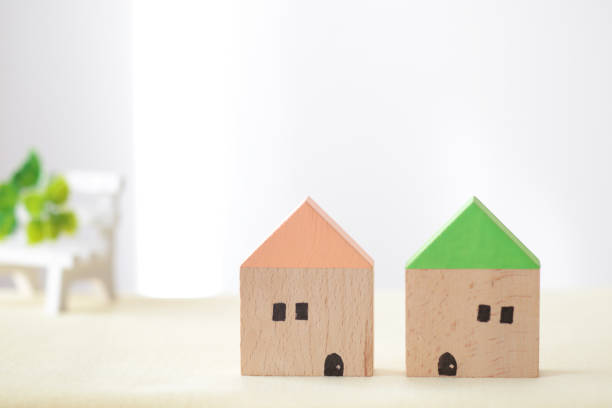 Woman hand holding a house model