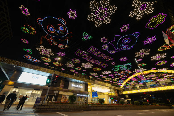 Hong Kong - December 17, 2024 : Holiday decorations at night in the Tsim Sha Tsui area of Hong Kong.