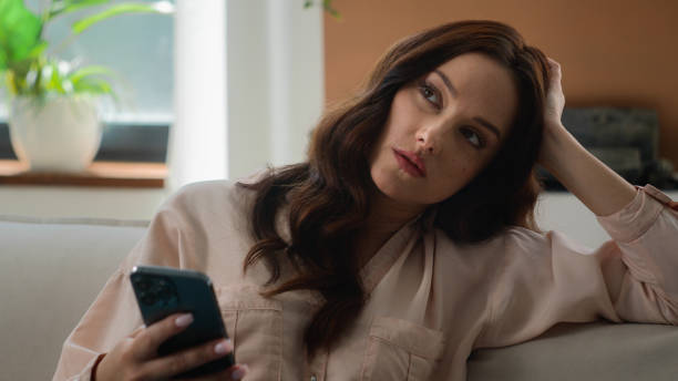 istock Caucasian woman scrolling mobile phone browsing smartphone receive negative answer disappointed female chat app on cellphone girl indoors at home businesswoman in office feel sad annoyed upset failure 2190489304