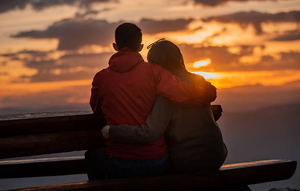 istock Lovely romantic couple enjoying the sunset. 2190490089