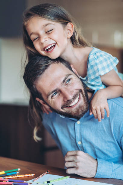 istock Father and daughter having fun at home 2190490406