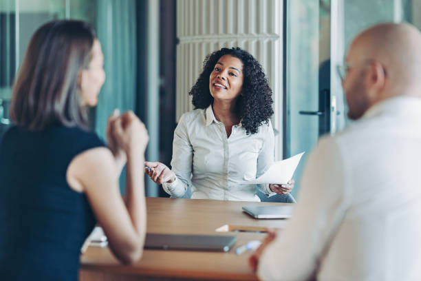 istock Businesswoman talking to customers 2190490417