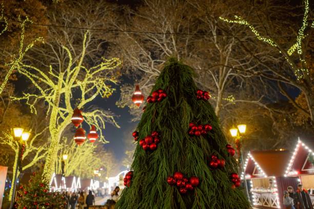 istock Festive Christmas market scene at night. 2190490611