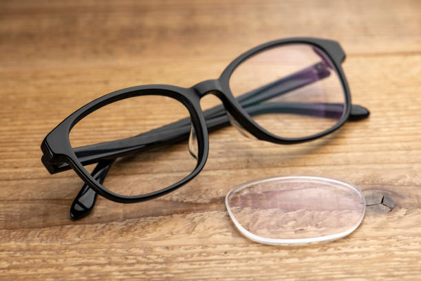 istock Eyeglass Lens Placed on Wooden Table 2190490929