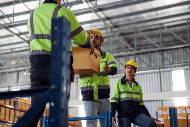 istock The staff is working in the office document storage area. The warehouse workers are checking the stock on the shelves in the production department. 2190490964