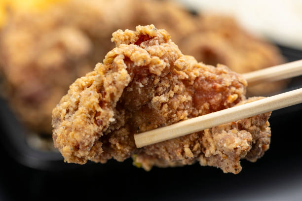 istock Picking Up Fried Chicken with Chopsticks from Karaage Bento 2190491061