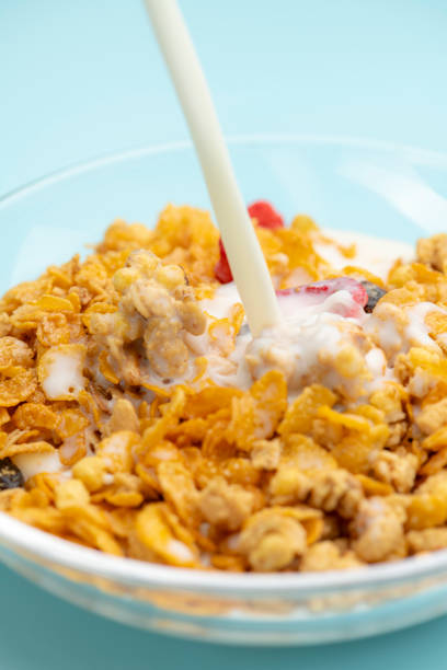istock Pouring Milk Over Granola for Breakfast 2190491123