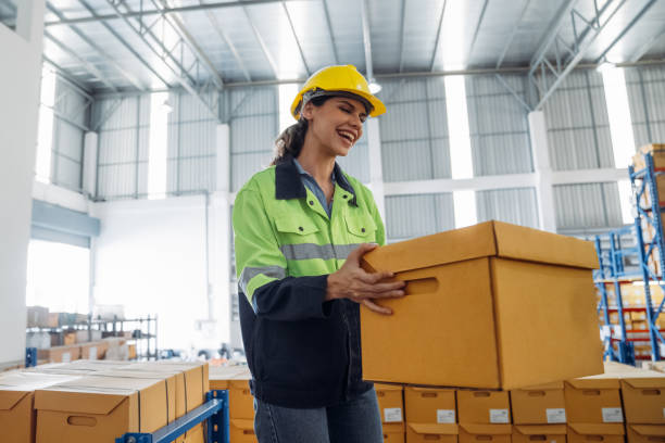 istock The staff is working in the office document storage area. The warehouse workers are checking the stock on the shelves in the production department. 2190491133
