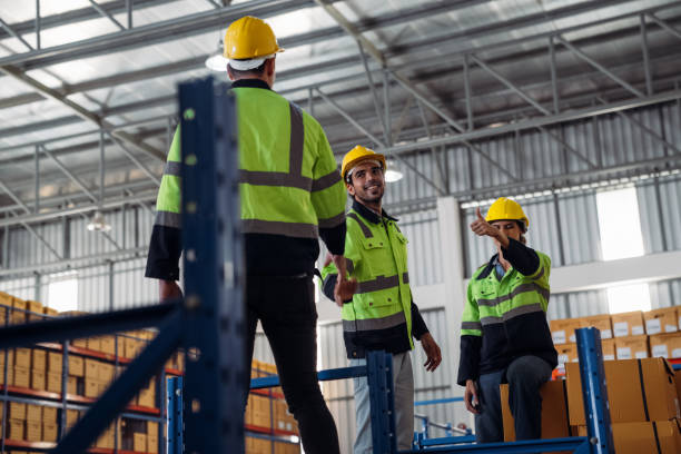 istock The staff is working in the office document storage area. The warehouse workers are checking the stock on the shelves in the production department. 2190491149