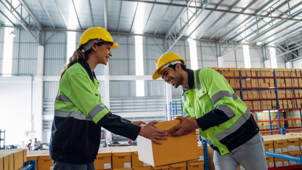 istock The staff is working in the office document storage area. The warehouse workers are checking the stock on the shelves in the production department. 2190491178
