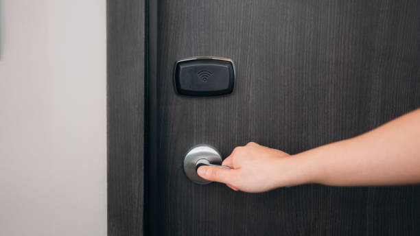 istock A person is opening a door with a key 2190494091