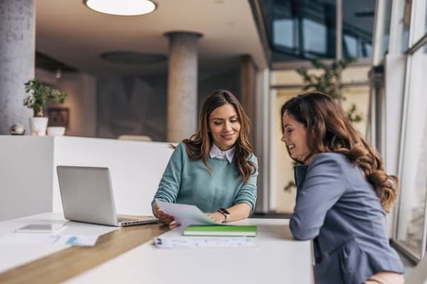 istock Businesswomen working together on a project in a modern office 2190495033