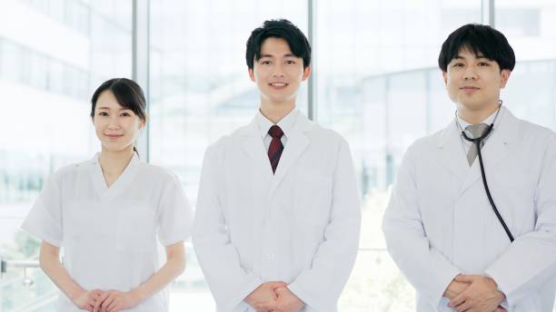 istock Smiling doctor and nurse standing 2190495198