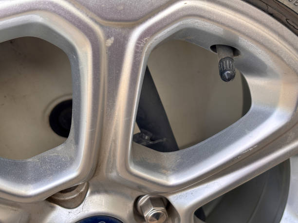 istock A tire has a hole in it and the rim is missing 2190495568