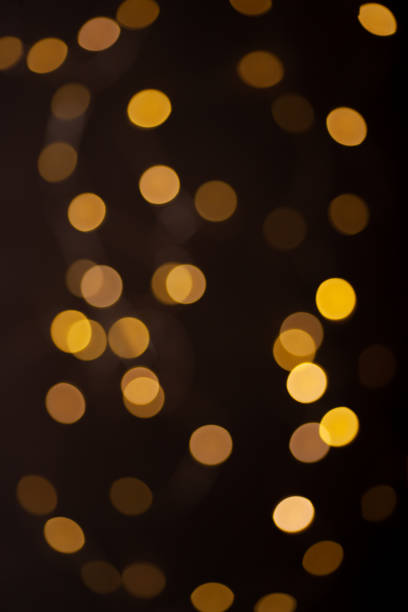 istock Christmas lights in bokeh. Yellow and fire orange bokeh 2190495867