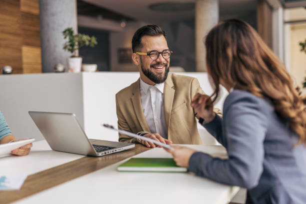 istock Two business people talk project strategy at office 2190496824