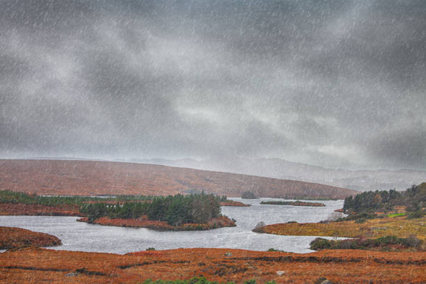 istock Rainy irish landscape with river and hills 2190497046