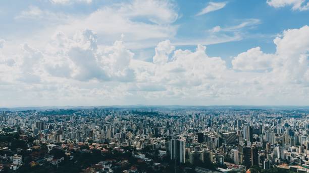 istock Cityscape under a vibrant blue sky with clouds. 2190497418