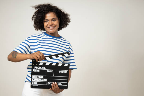 istock Curly young woman with number plate on white background, space for text 2190497582