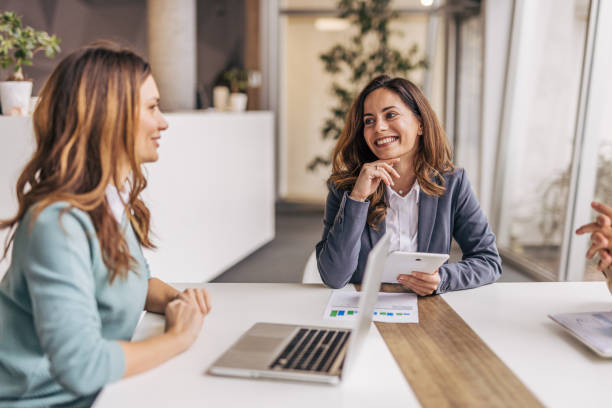 istock Businesswomen working together on a project in a modern office 2190497812