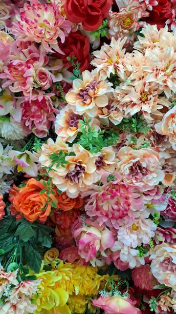 istock Background wall with artificial flowers of various colors 2190497897