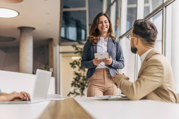 istock business woman giving a presentation 2190497930