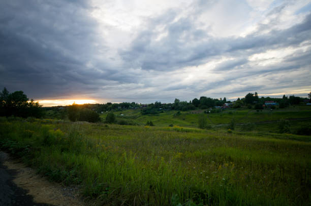 Field after harvesting grain on a cloudy day, Russia
