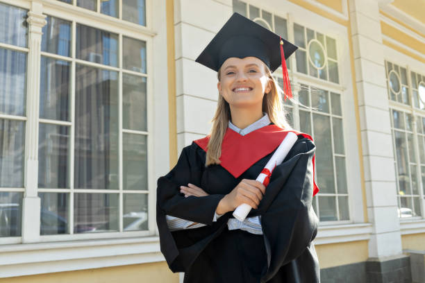 istock A young girl, a university graduate, in a robe. 2190503095
