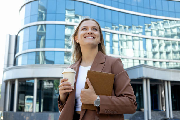 istock A girl in a business suit with a notebook. 2190503169