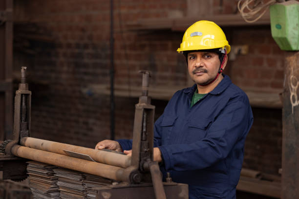 istock Industrial worker at factory, looking at camera. 2190503510
