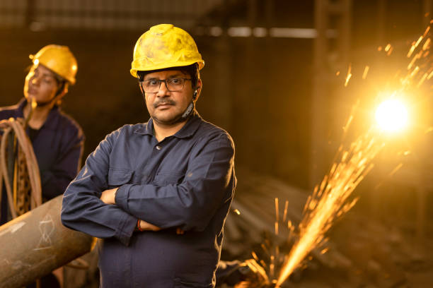 istock Industrial worker at factory, looking at camera. 2190503720