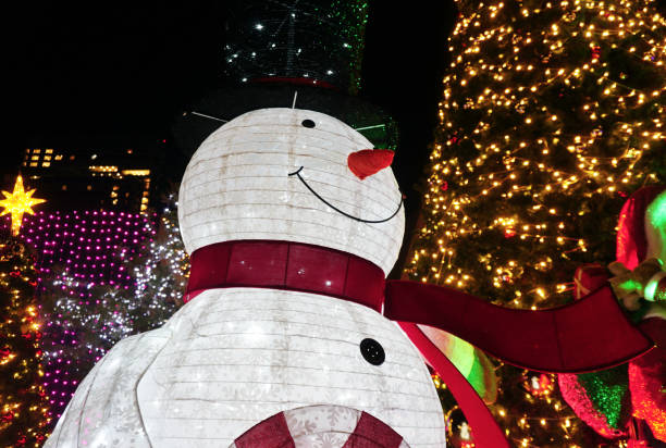 istock Snow man with LED lighting decoration at tree, Christmas theme 2190504527