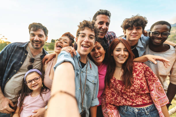 istock Diverse group selfie, joyful friends and family outdoors, multicultural gathering with genuine laughter 2190505250