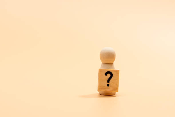 istock Wooden figure with a question mark. 2190507375