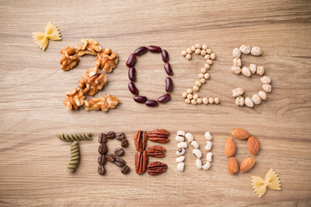 istock 2025 trend alphabet made from walnut, red bean, soybean, chickpea, pasta, coffee bean, pecan, black eyed pea and almond on wooden background 2190508038