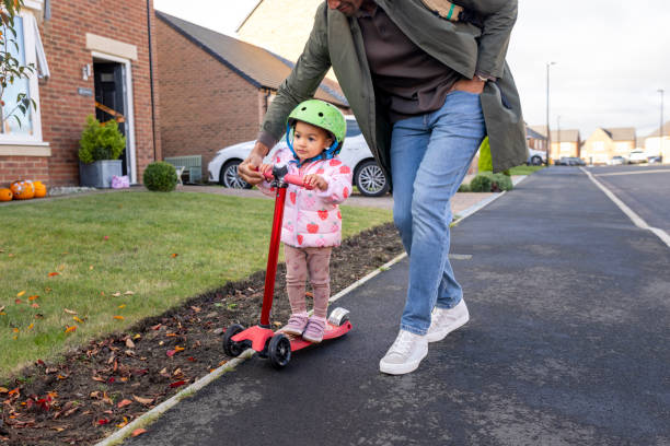 istock Toddler Learning to Ride a Scooter 2190508288