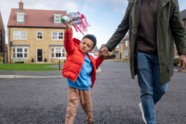 istock Father and Son Enjoying Outdoor Playtime toy rocket 2190508315