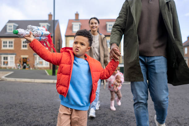 istock Boy Displays Toy Rocket During Family Time 2190508316