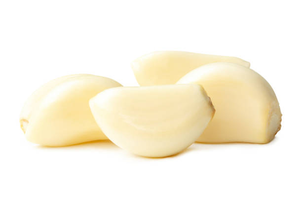istock Side view of peeled garlic cloves in stack isolated on white background with clipping path 2190509491