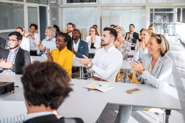 istock Enthusiastic Diverse Professionals Applauding at Conference 2190510283