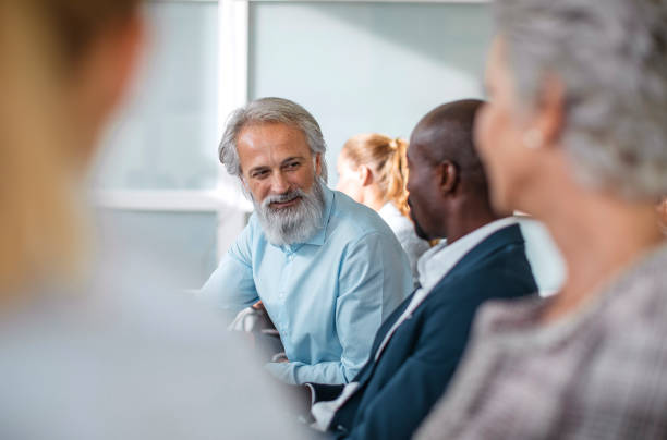 istock Diverse Professionals Engaging in Lively Conference Discussion 2190510302