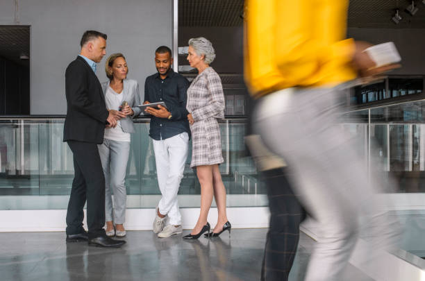istock Diverse Professionals Engaged in Dynamic Business Discussion 2190510316